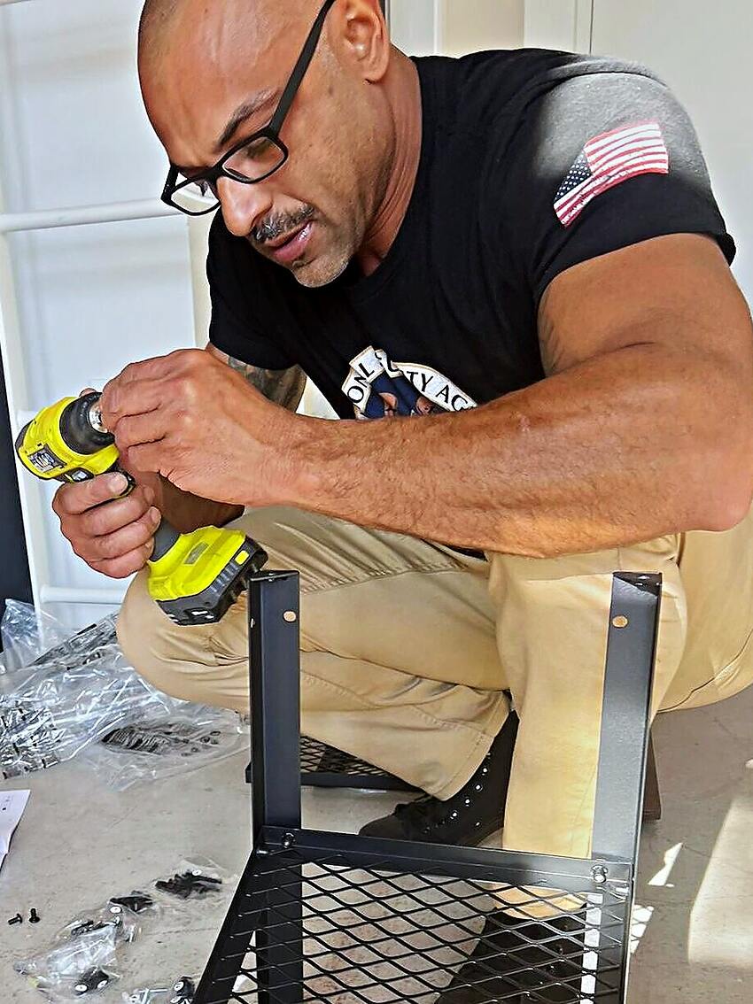 Junior Elite Services crew member assembling a unit on a Bay Area job site