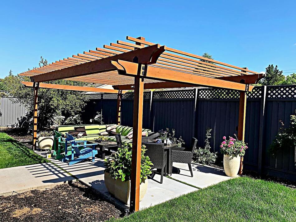Custom redwood pergola over a patio in a Peninsula backyard