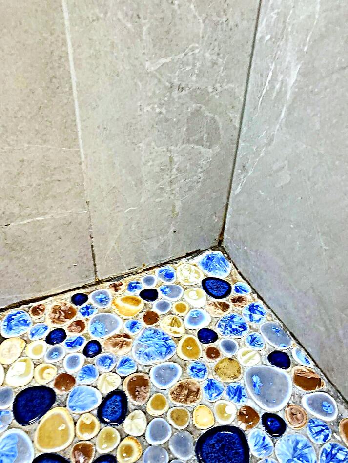 Pebble glass mosaic tile detail in a Bay Area bathroom remodel